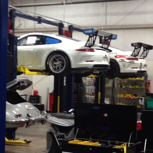 A Porsche raised on a lift